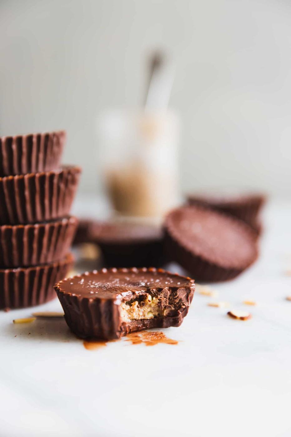 These rich and decadent almond butter cups are made with just 5 ingredients - dark chocolate, coconut oil, almond butter, chopped almonds, and sea salt. Perfect healthy-ish snack!