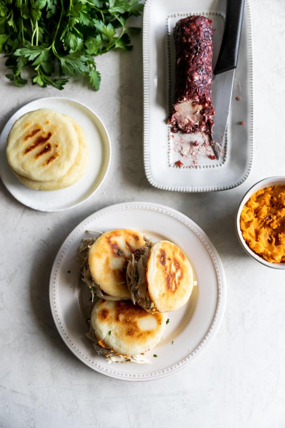 Easy-to-make arepas (pan fried corn cakes) made with homemade cranberry goat cheese and your favorite Thanksgiving leftovers!