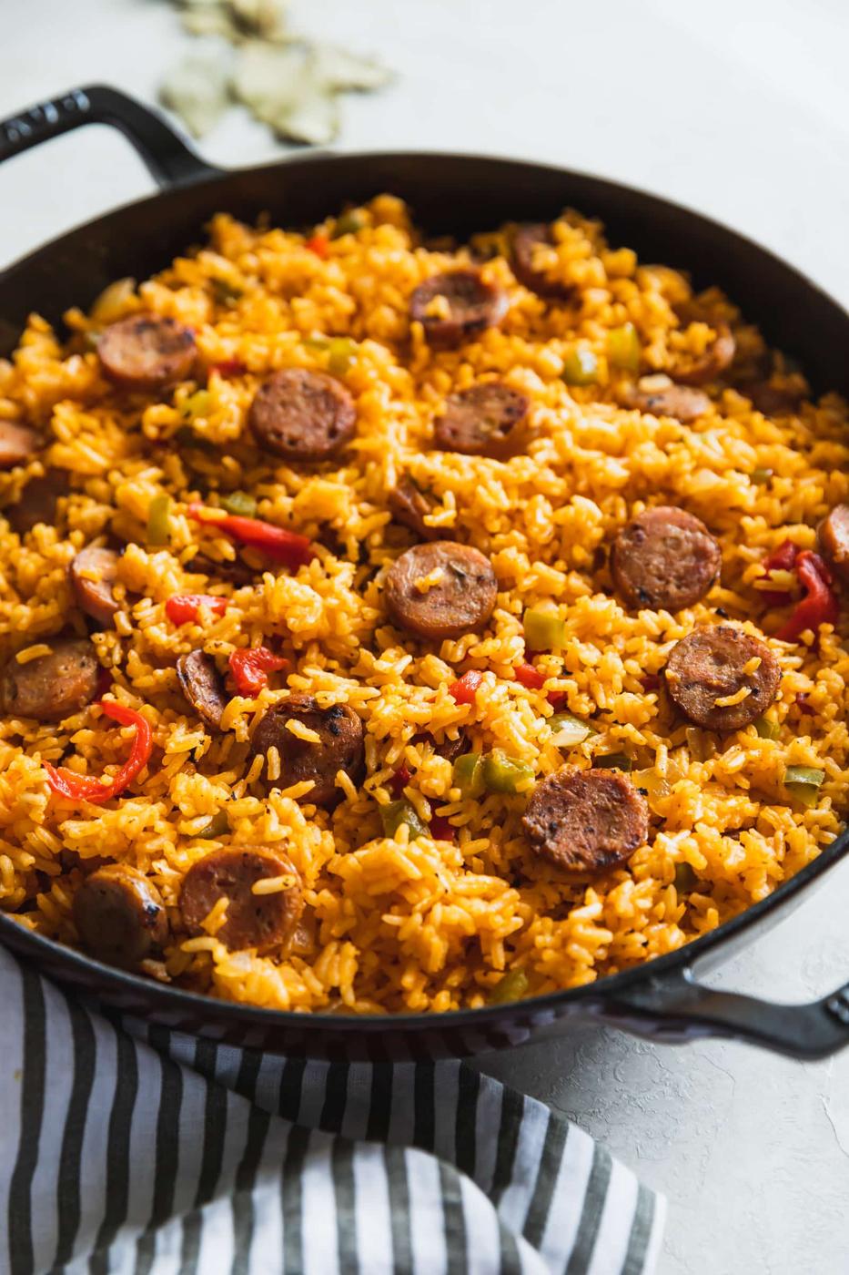 cooked Cuban arroz con salchichas in a braiser