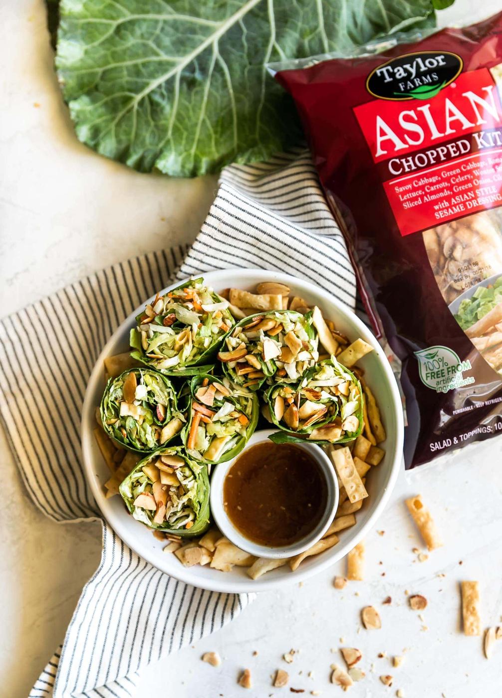 Simple collard green wraps made with avocado, savory green cabbage, carrots, celery, green onions, cilantro, toasted slivered almonds, crisp wontons, and sweet sesame ginger dressing!