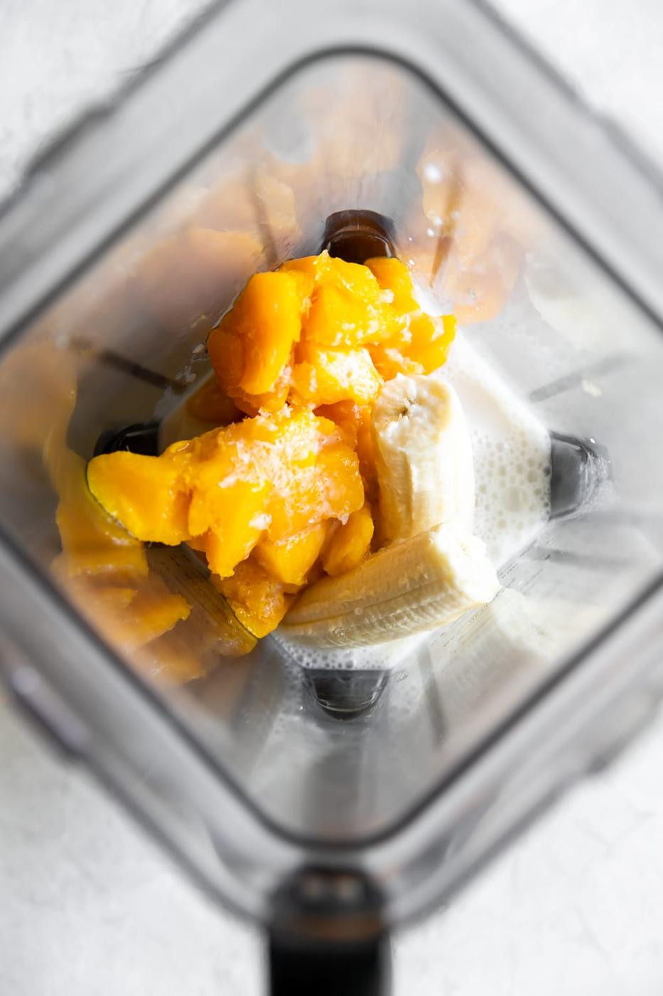 ingredients for mango shake in the blender