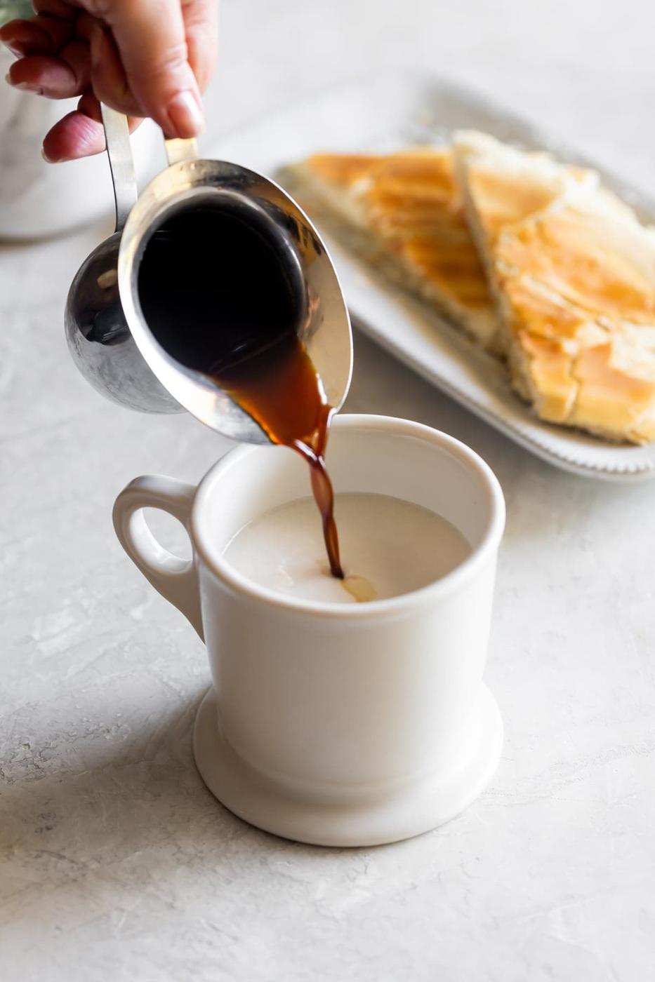 cuban coffee being poured into milk