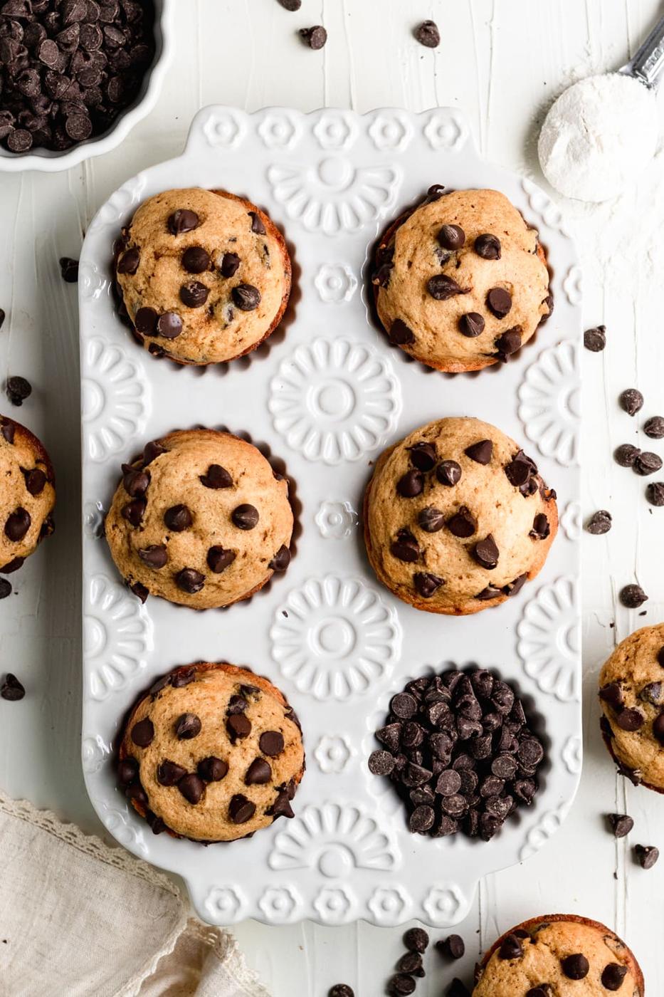 freshly baked chocolate chip muffins in a muffin tin