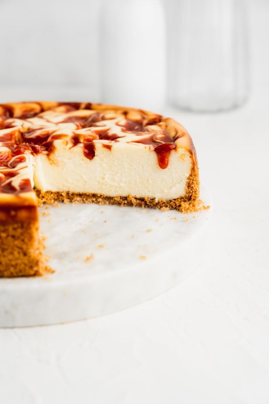 creamy guava swirl cheesecake with a guava marmalade drip