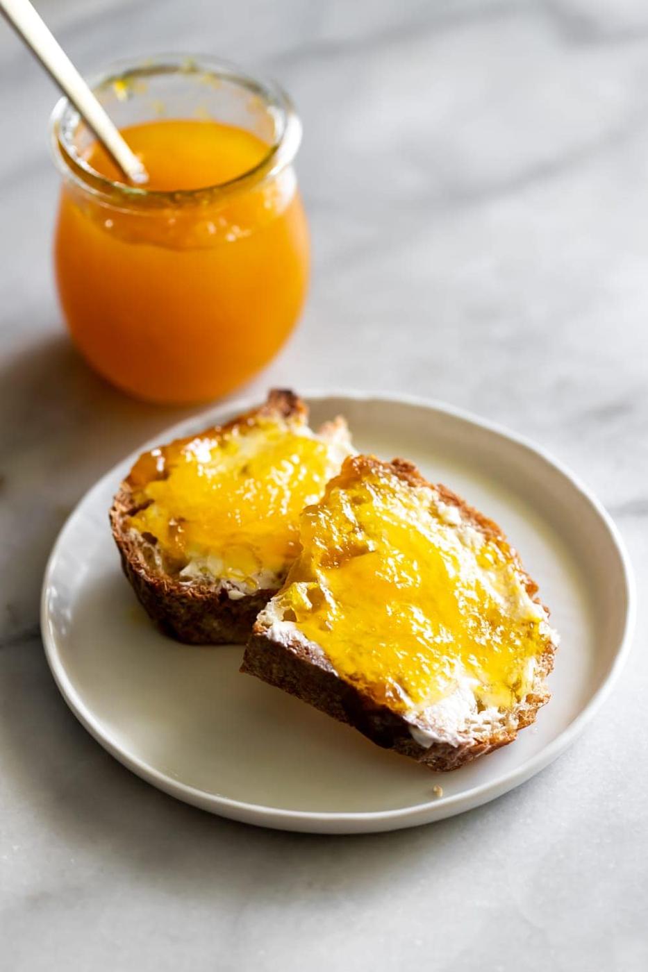 mango jam spread on toasted bread with butter