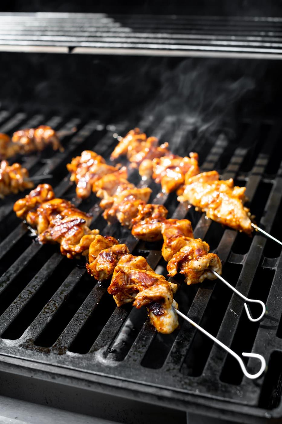 pinchos de pollo (Cuban chicken skewers) on a grill