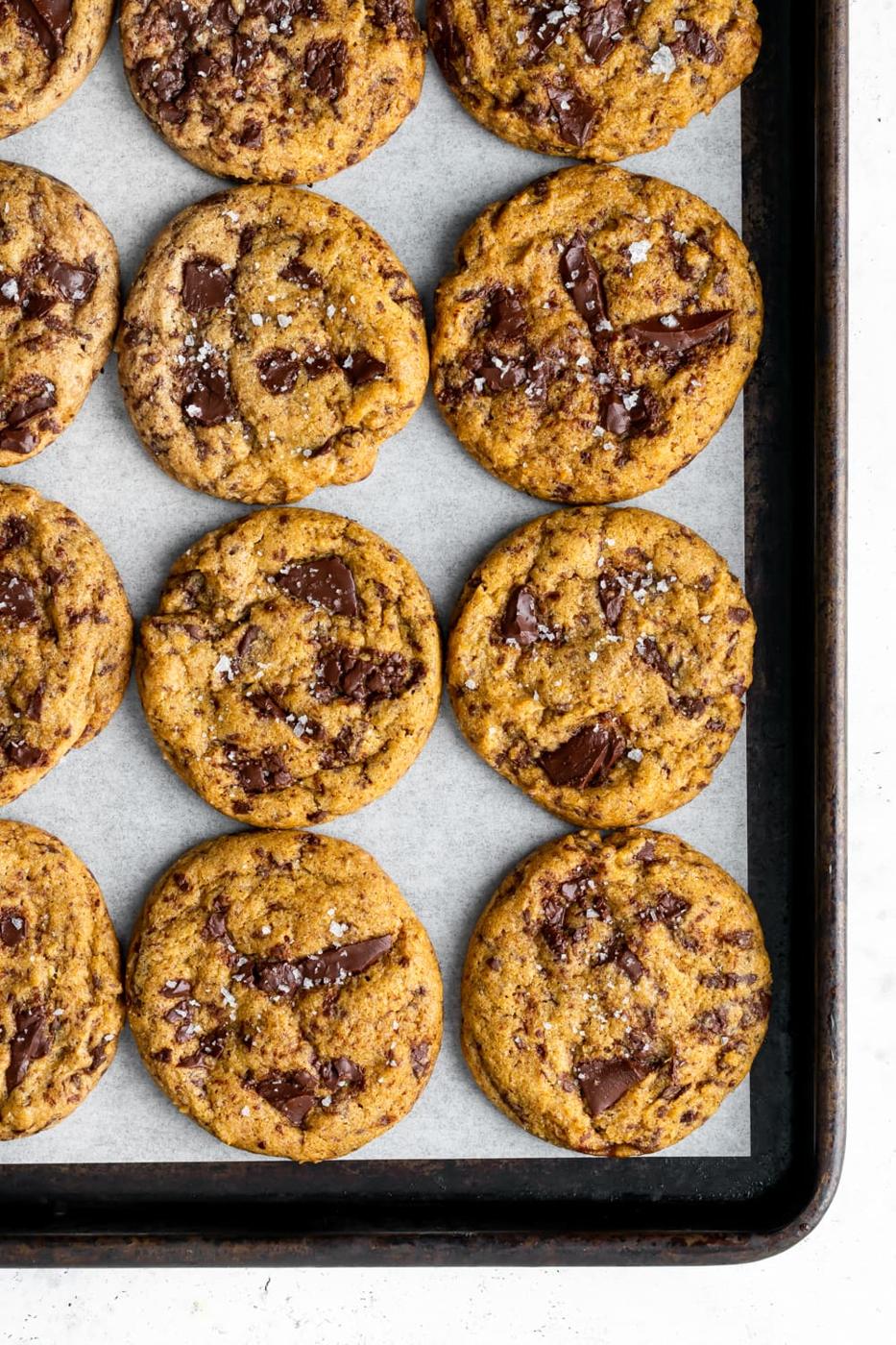 chewy pumpkin chocolate chip cookies on a baking sheet