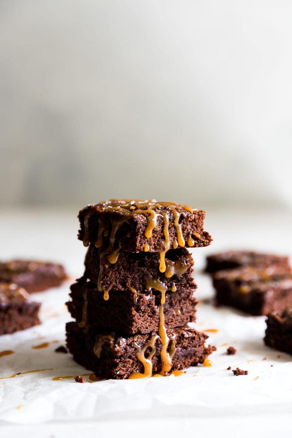 Super thick, fudgy, rich and delicious dark chocolate brownies swirled with homemade salted caramel sauce and a pinch of sea salt!
