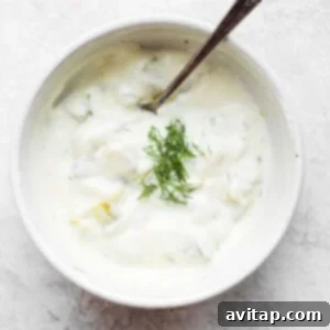 Easy Golden Salmon Patties 2 Creamy dill pickle dip in a bowl, garnished with fresh dill