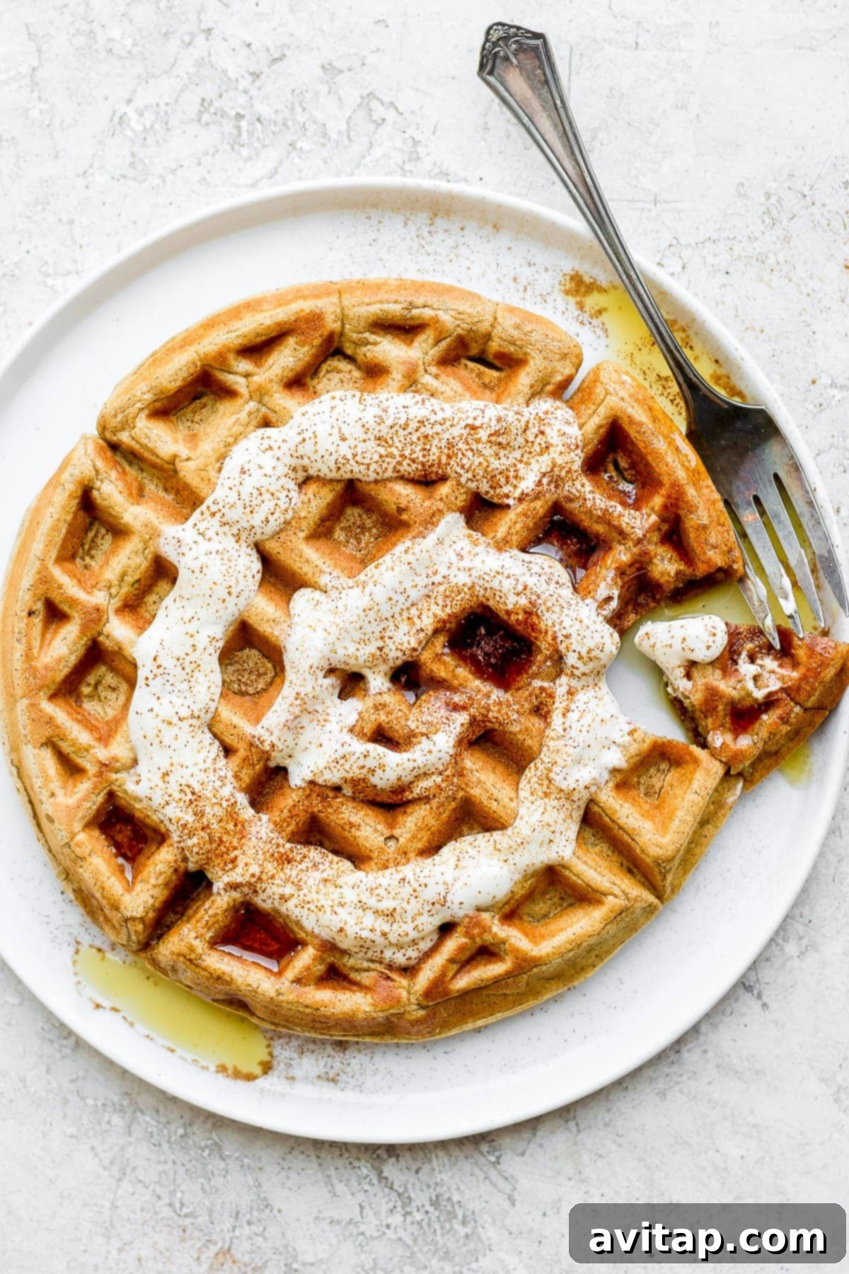 Cinnamon Swirl Waffles 2 cinnamon roll waffles topped with a greek yogurt cream cheese drizzle