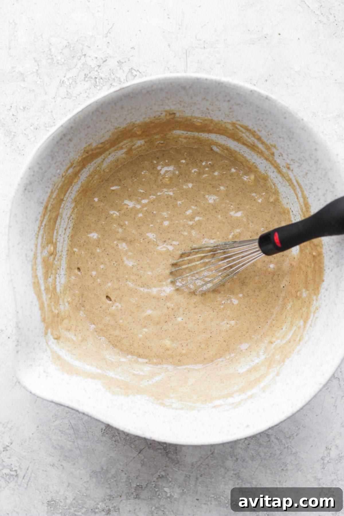 Cinnamon Swirl Waffles 4 all the ingredients for cinnamon roll waffles mixed together in a bowl
