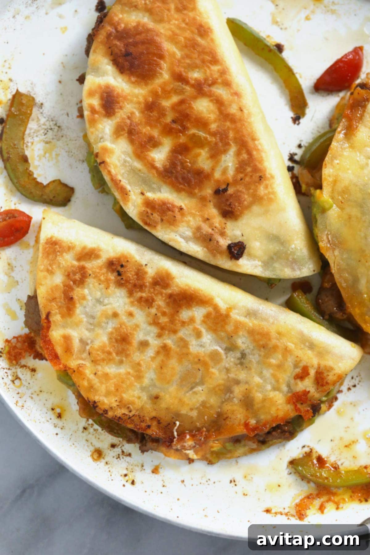 Crispy Chicken Quesadilla Cooking in a Pan Golden-brown chicken quesadilla sizzling in a hot skillet, showing a perfectly crispy exterior and melted cheese.