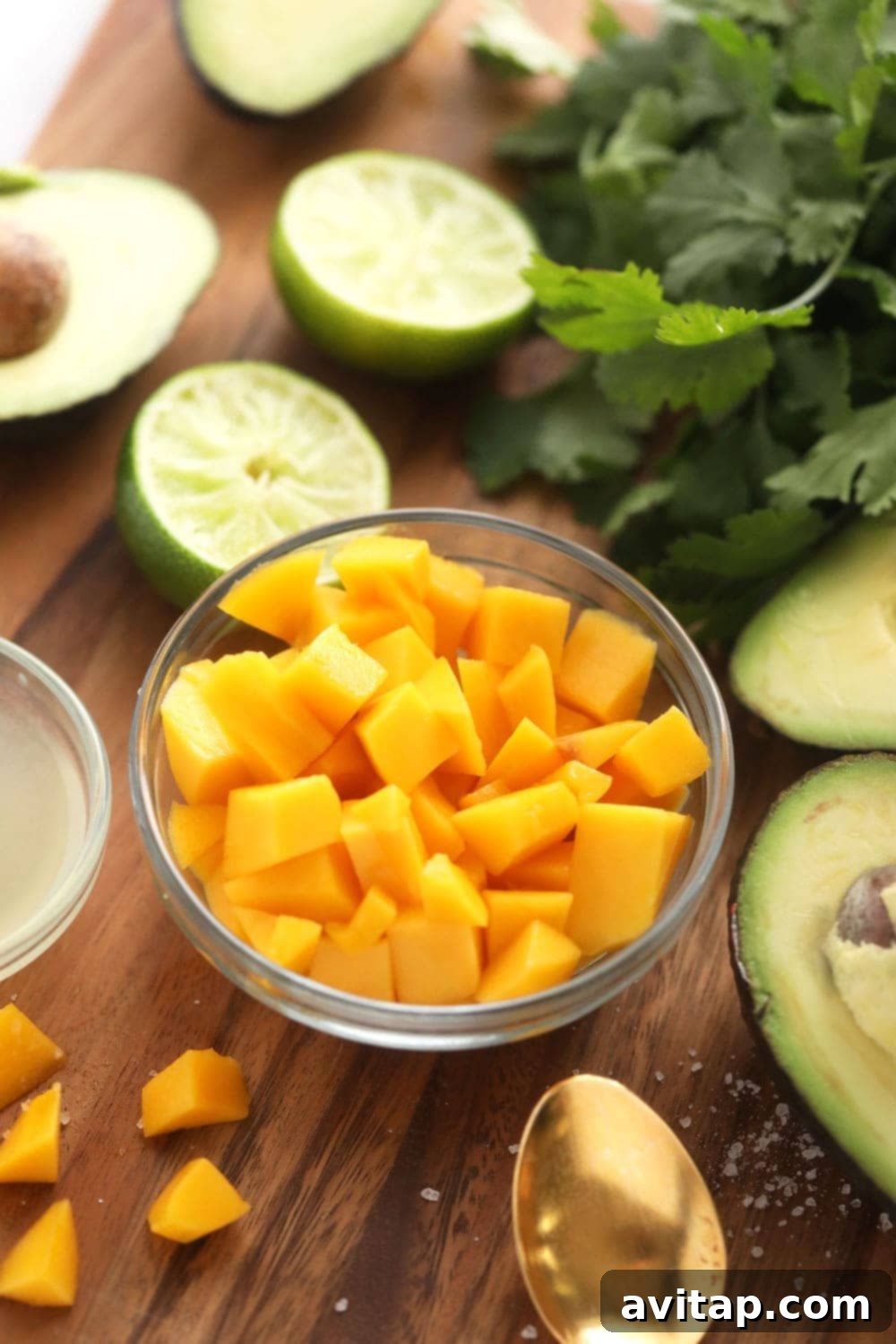 Freshly Diced Mango for Guacamole Close-up of perfectly diced ripe mango cubes in a bowl, ready to be added to the guacamole mixture for a sweet tropical flavor.
