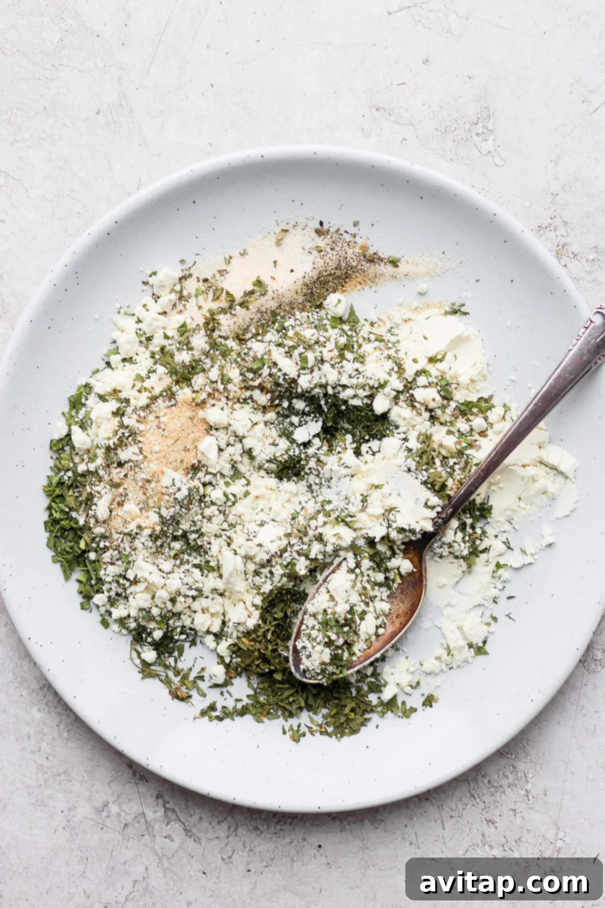 A close-up view of various ranch seasonings beautifully mixed together on a plate, highlighting the texture and perfect blend of dried herbs and spices, ready to be stored or used.