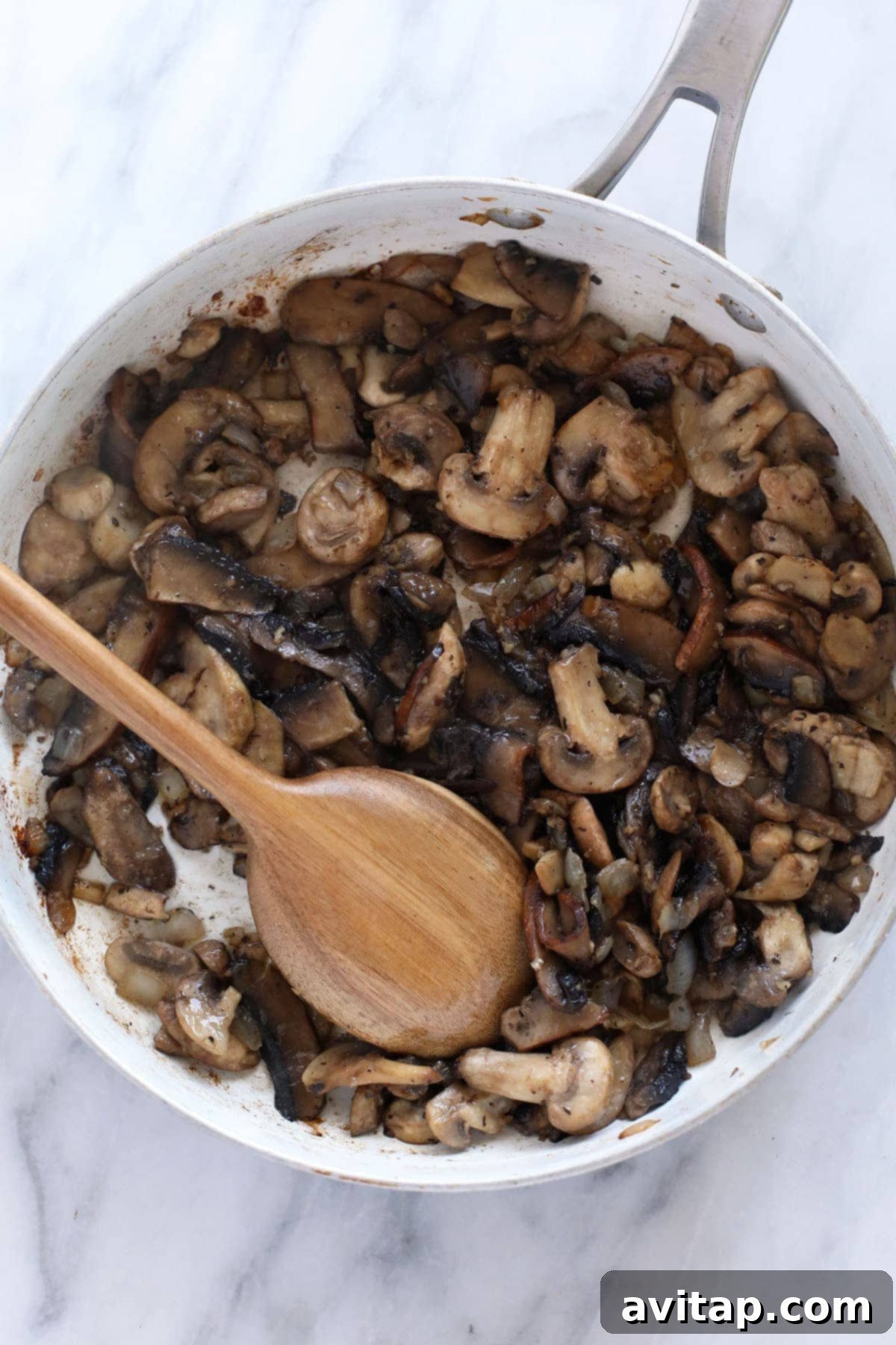 Velvet Mushroom Supper 5 Sautéed mushrooms browning in a fry pan.
