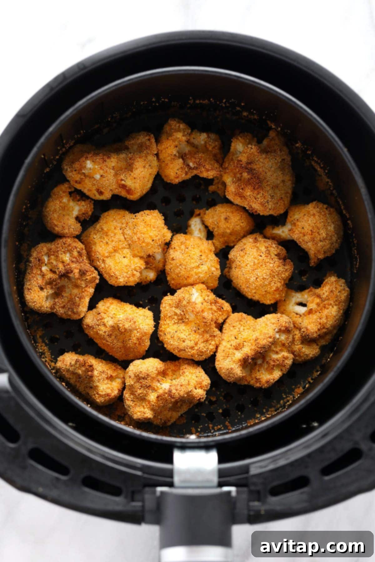 crunchy cauliflower in air fryer that is golden brown