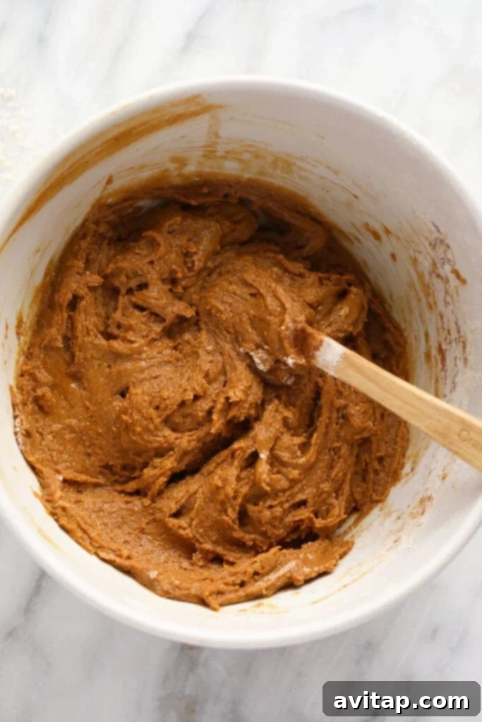 Smooth gingerbread cookie bar batter ready for baking, mixed in a bowl.