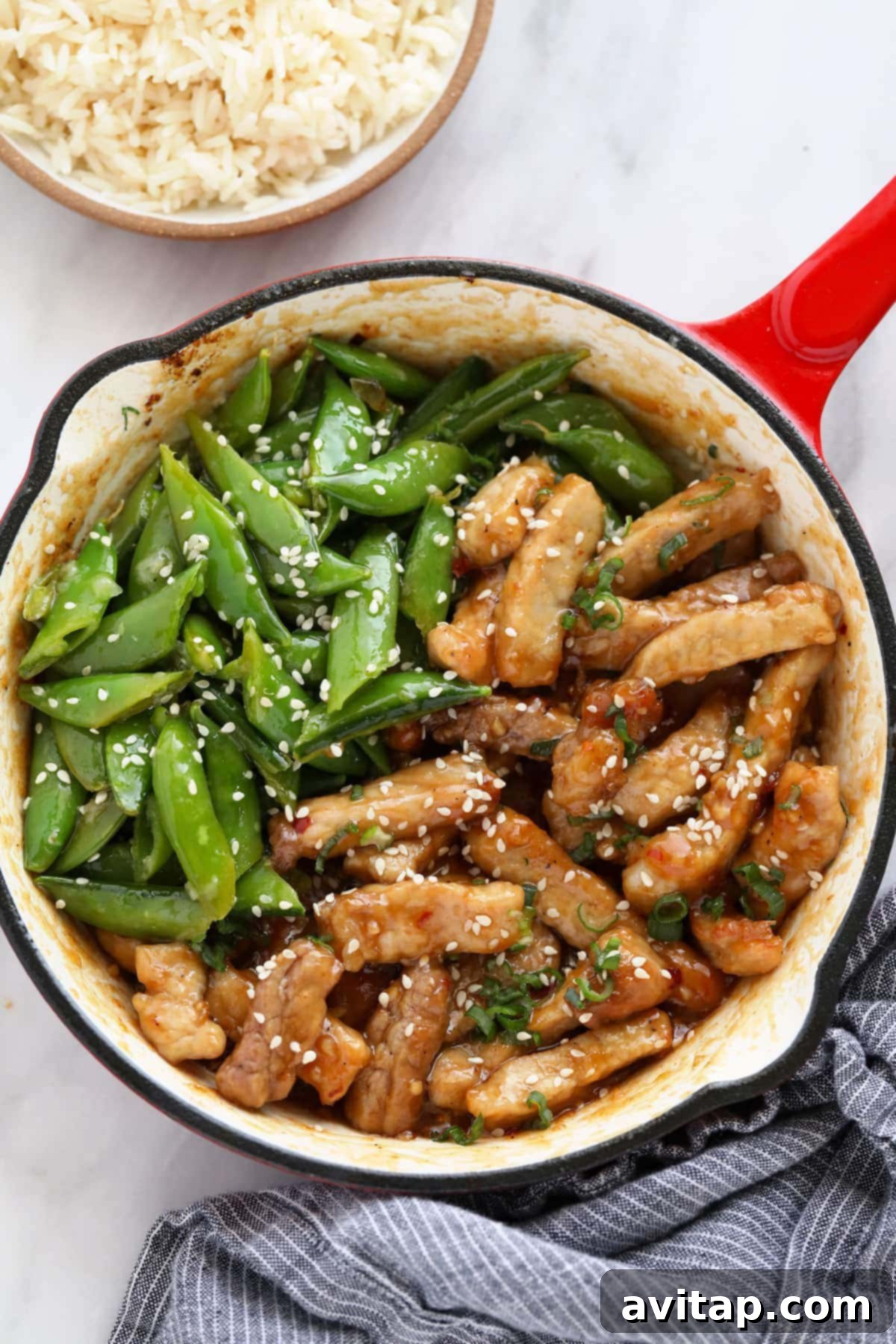 Sticky Honey Pork sizzling in a pan, a mouth-watering easy pork recipe.