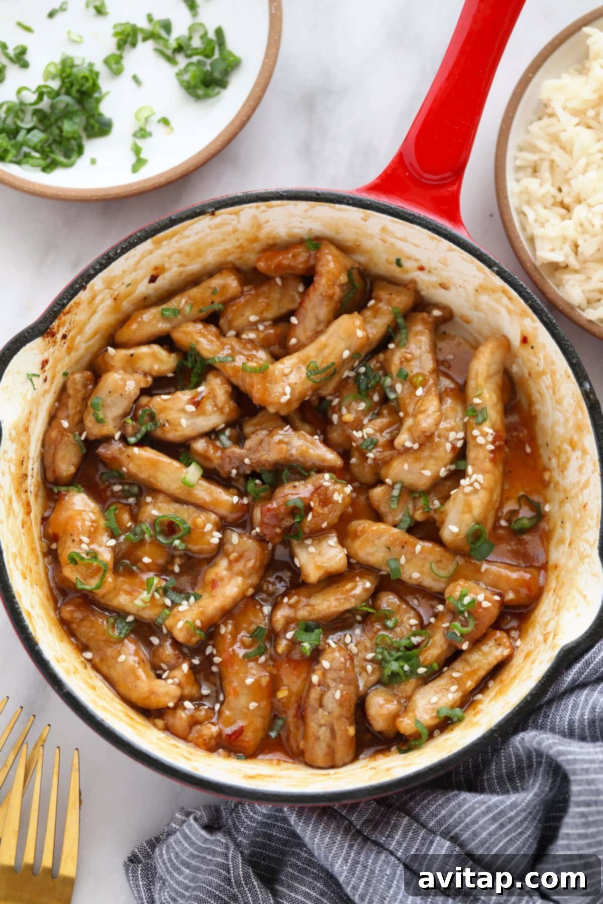 Sticky Honey Pork in a pan, glistening with the sauce, highlighting a successful pork recipe.