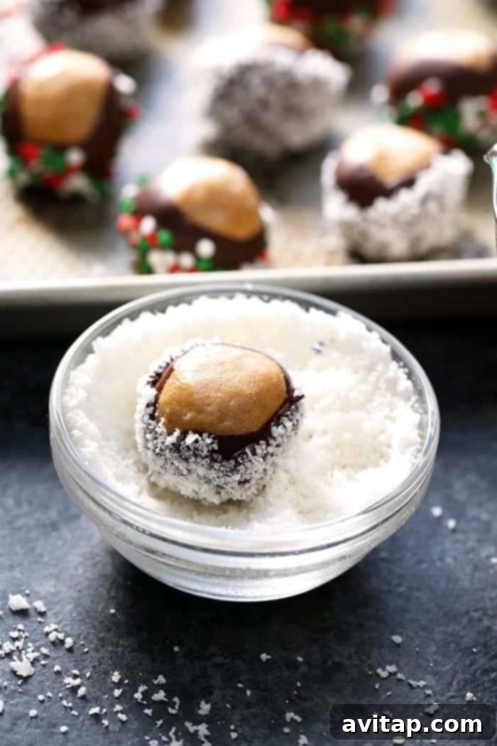 A baking sheet filled with healthy chocolate peanut butter truffles, ready to be chilled.