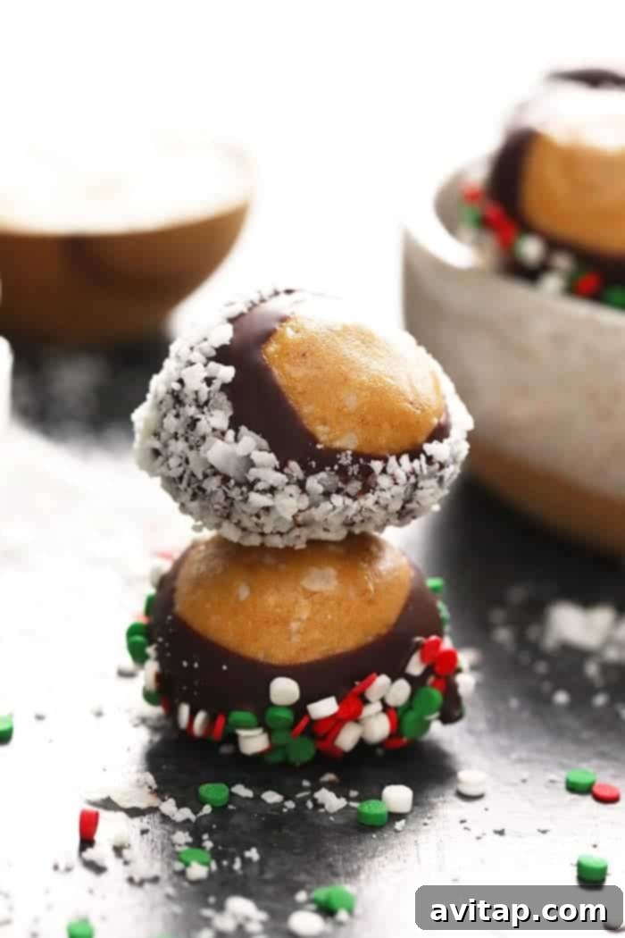 A stack of healthy chocolate covered peanut butter balls with sprinkles, showcasing the perfect finish.