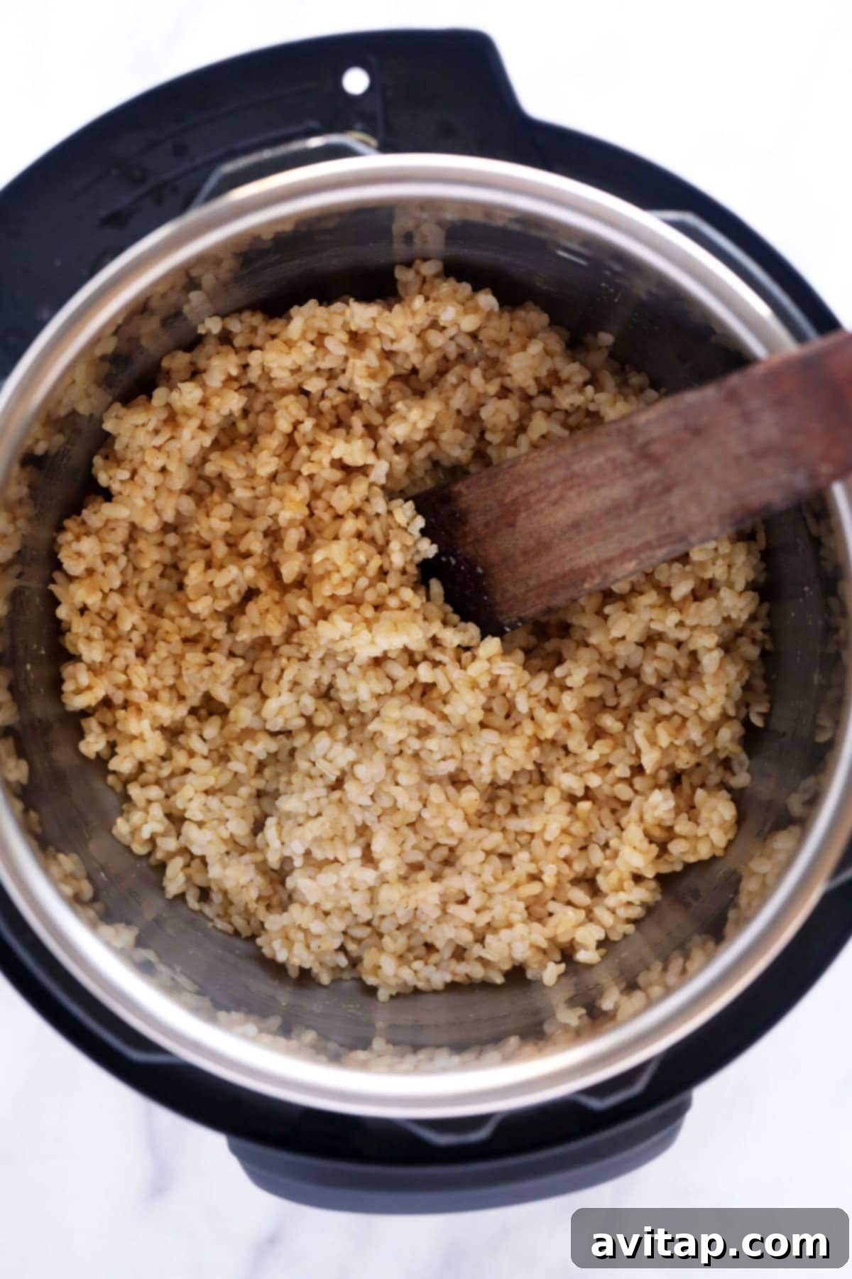 Fluffy brown rice served in a bowl, ready to eat, symbolizing perfection from the Instant Pot.