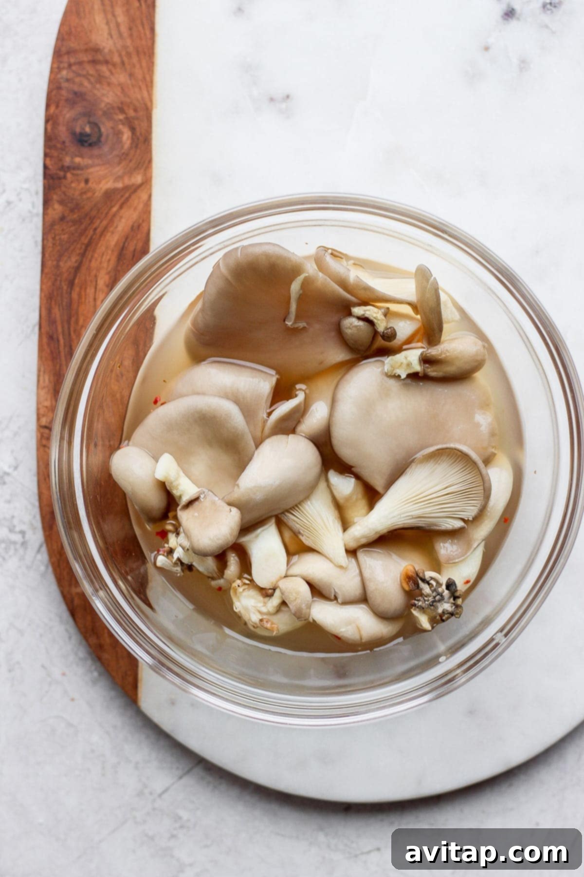 A bowl of freshly pickled mushrooms, vibrant and ready to top your ramen.