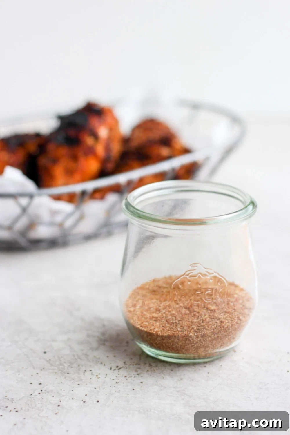 Dry rub for chicken perfectly blended and stored in a mason jar, ready for use