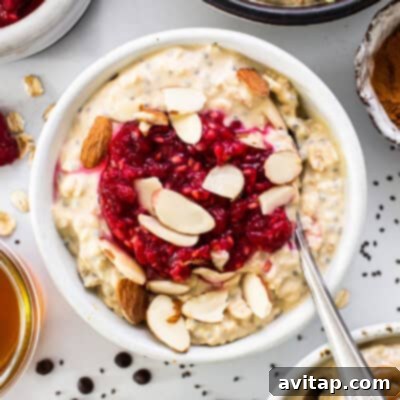 A beautifully presented bowl of protein overnight oats, generously topped with fresh berries, crunchy nuts, and a sprinkle of seeds, ready to be enjoyed.