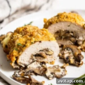 Perfectly cooked stuffed pork chop on a plate.