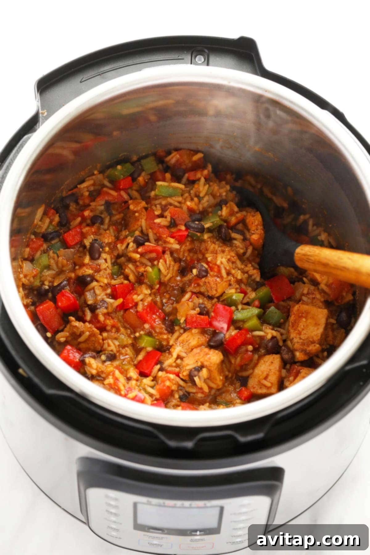 Quick Instant Pot Burrito Bowls 6 Close-up shot of a finished Instant Pot Burrito Bowl with tender chicken, fluffy rice, and colorful vegetables