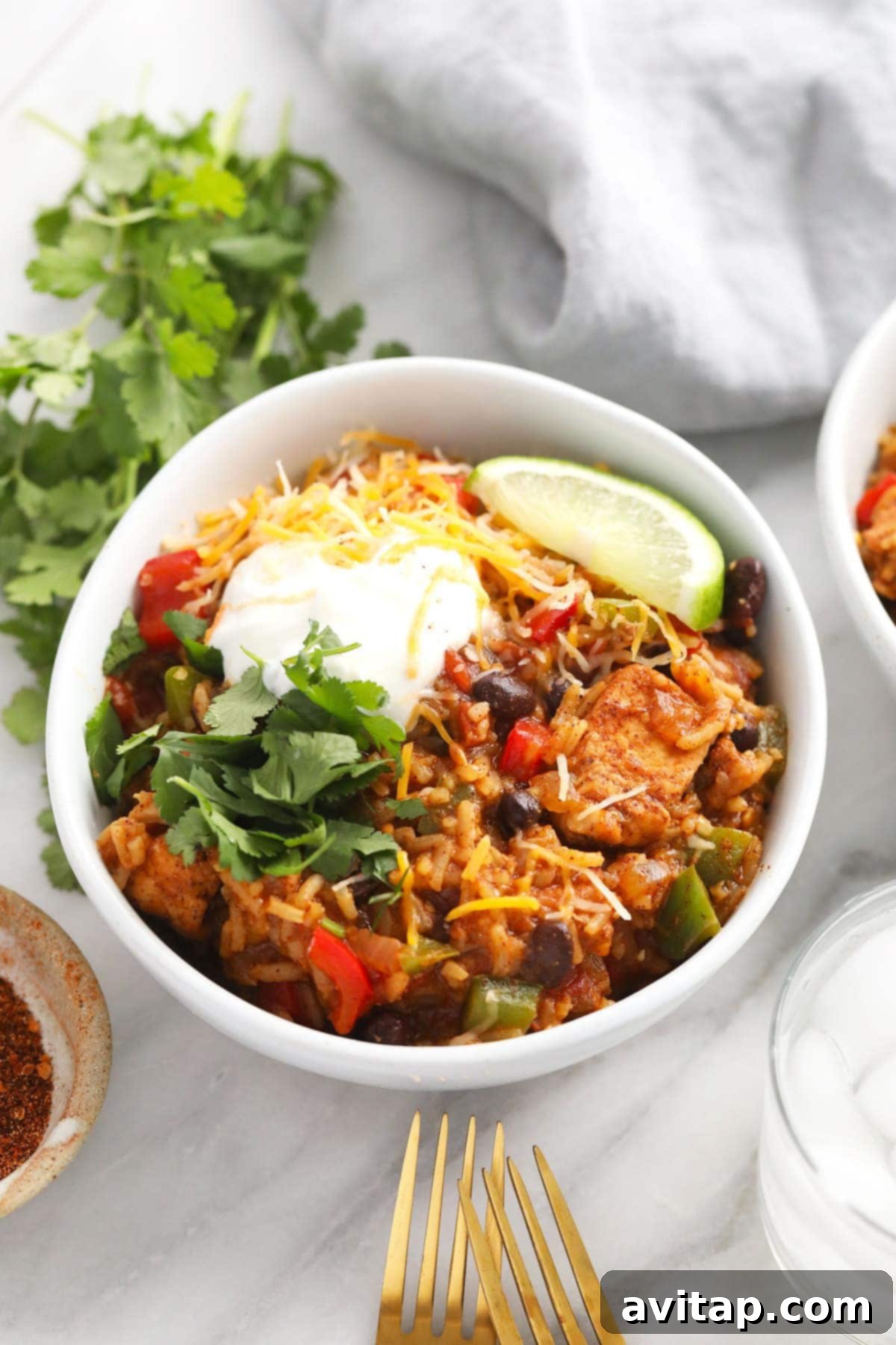 Quick Instant Pot Burrito Bowls 7 Delicious Instant Pot Burrito Bowl garnished with a swirl of Greek yogurt and a sprinkle of shredded cheese