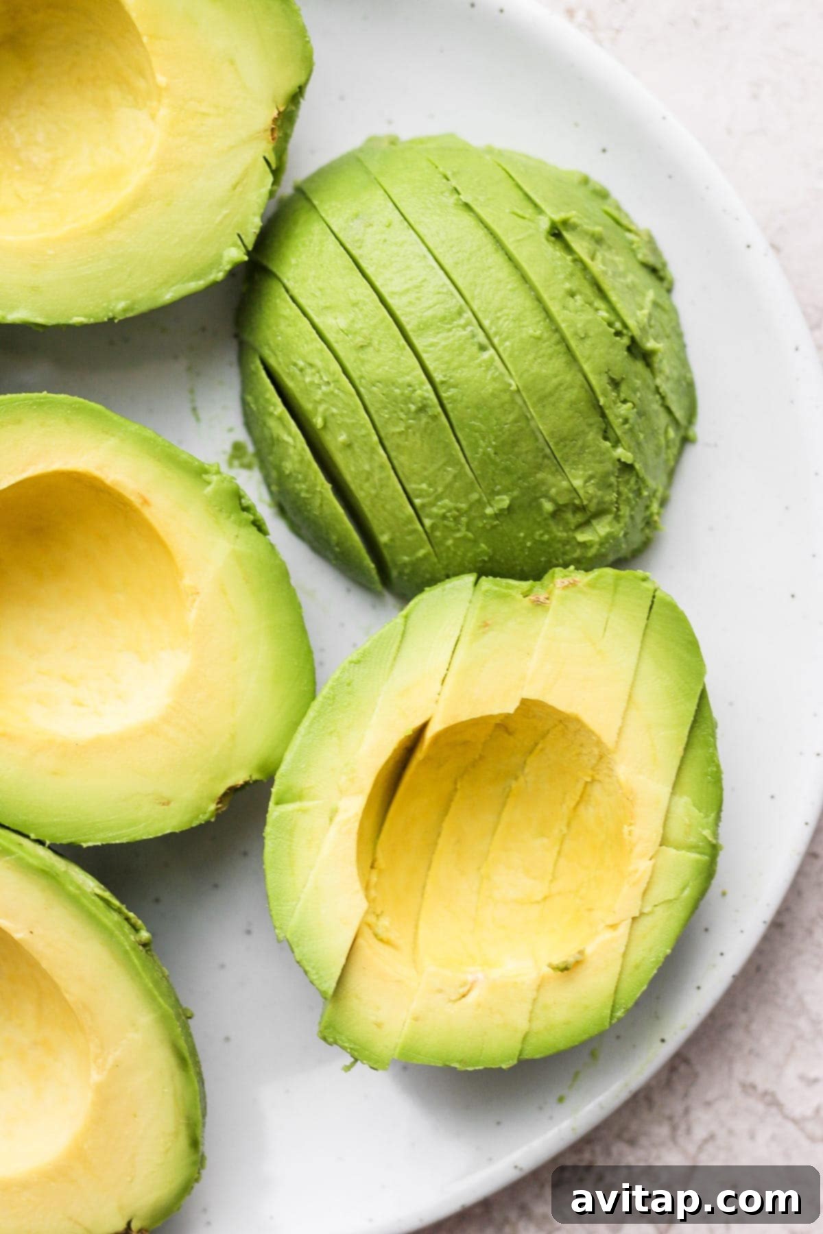 slices of avocado on a plate, ready to be frozen