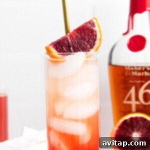 A Blood Orange Smash cocktail in a highball glass.