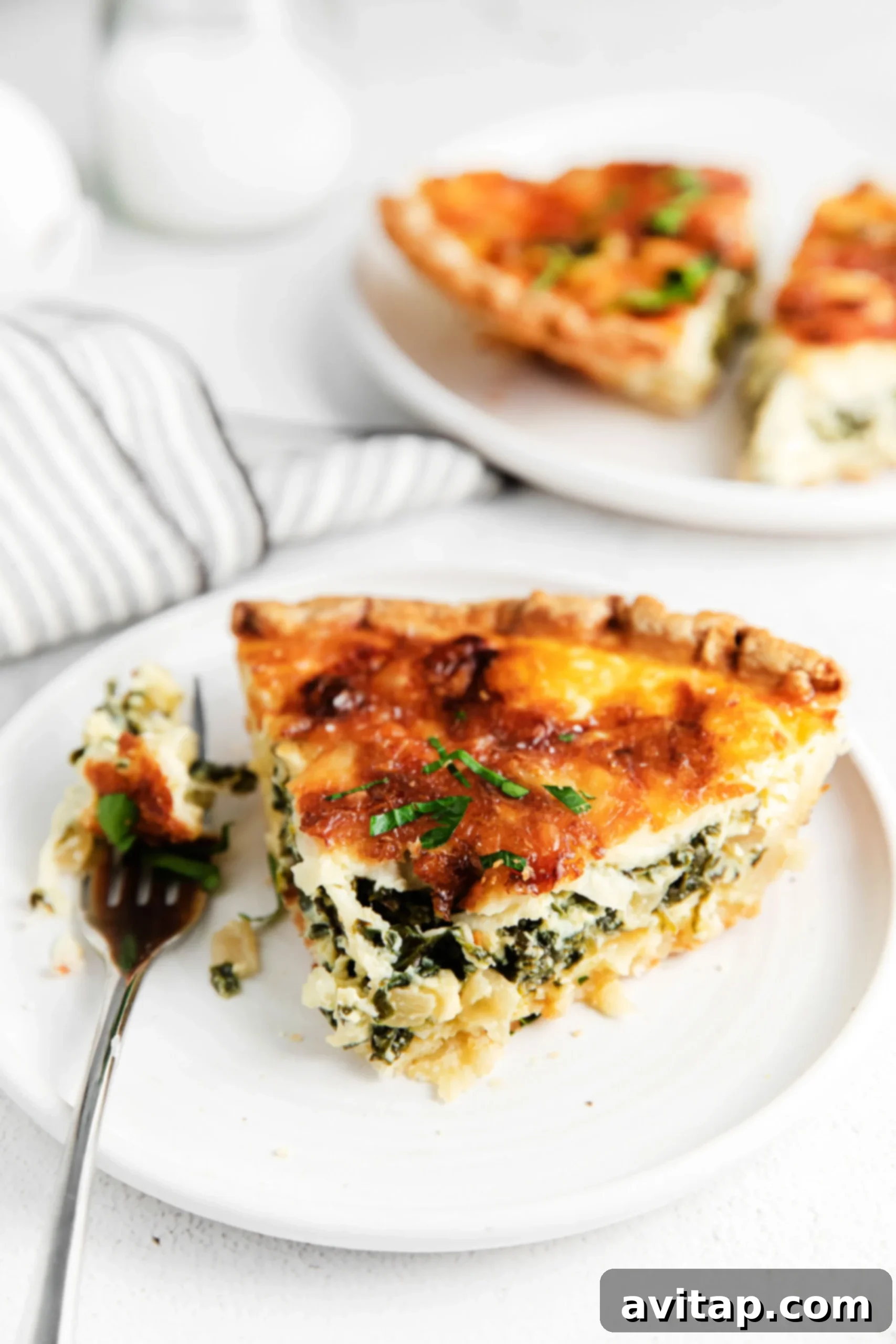 A vibrant and delicious spinach quiche served on a plate, ready for a healthy and satisfying meal.