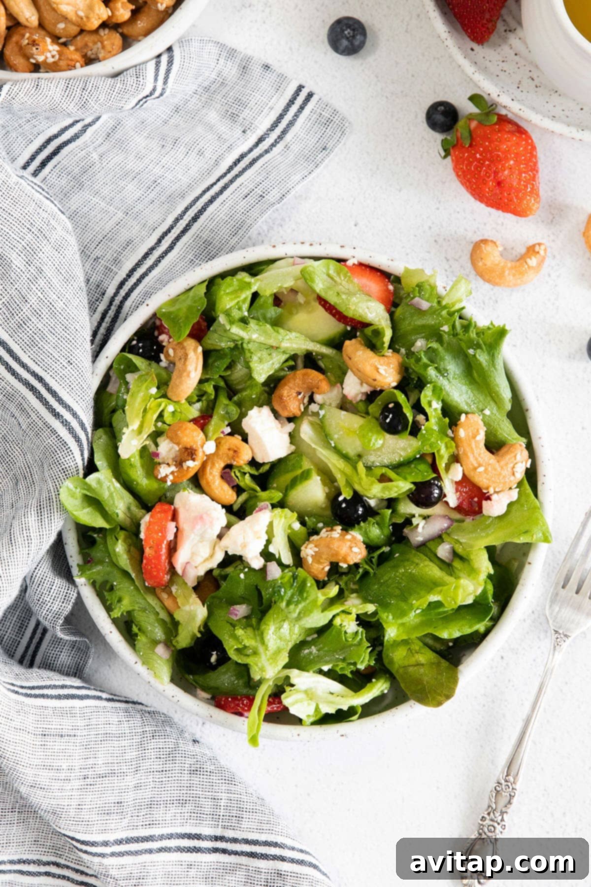 A beautiful bowl of spring mix salad, showcasing its diverse ingredients and vibrant colors.