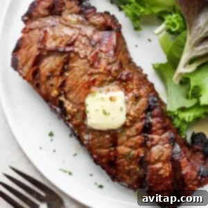 Grilled steak on plate with butter