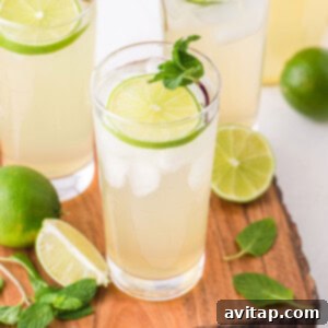 fresh homemade limeade in a glass with garnishes