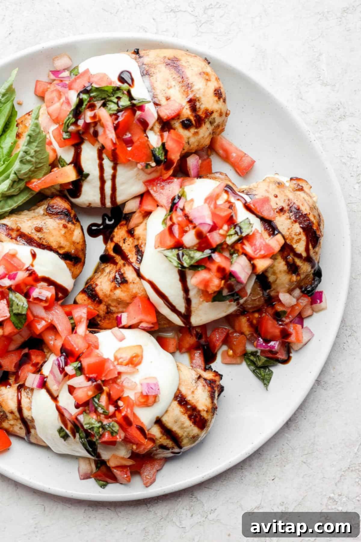 Bruschetta chicken, elegantly topped with mozzarella, diced tomatoes, basil, and a final drizzle of balsamic glaze.