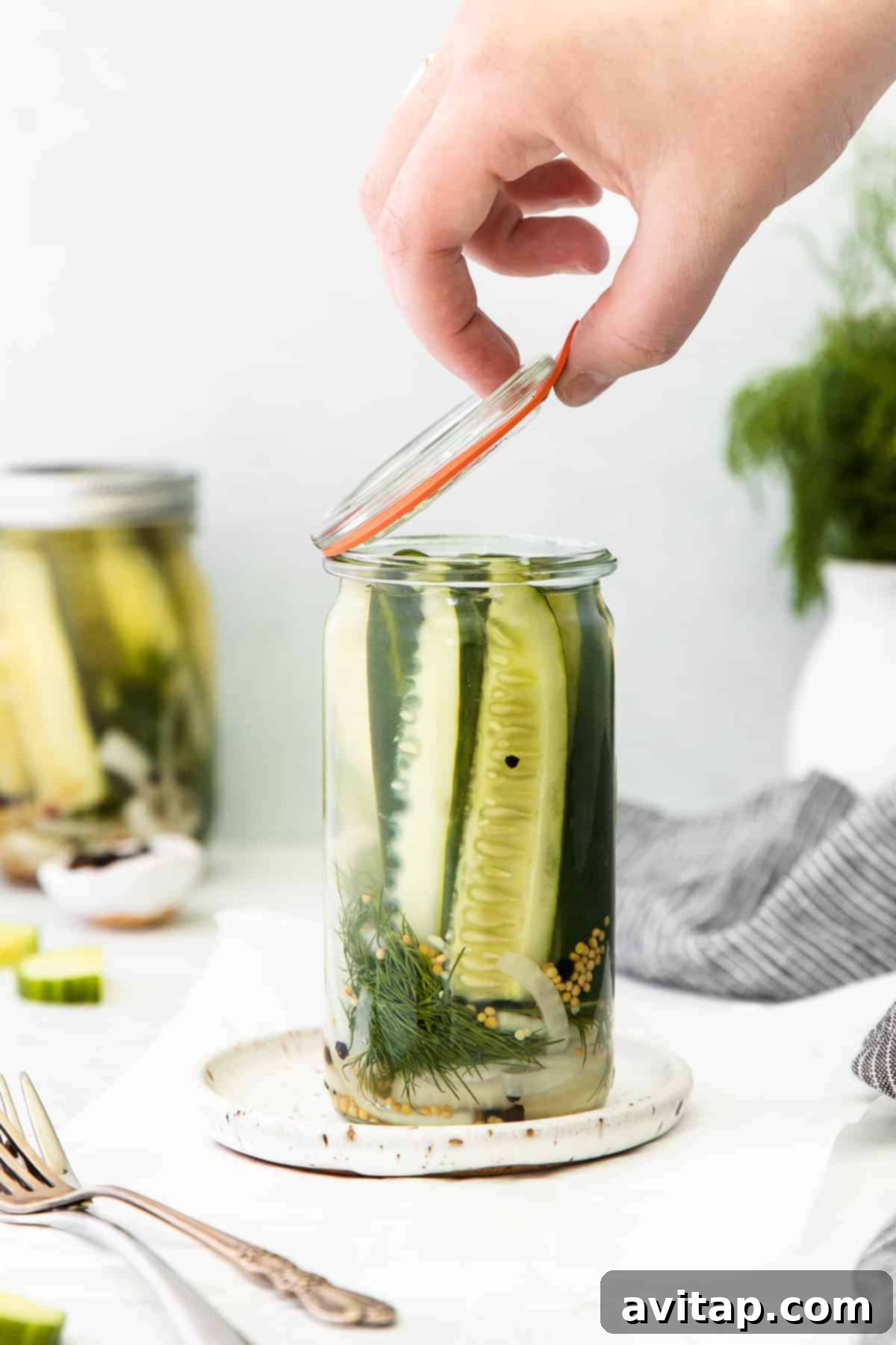 A jar full of delicious dill refrigerator pickles, ready to be enjoyed.