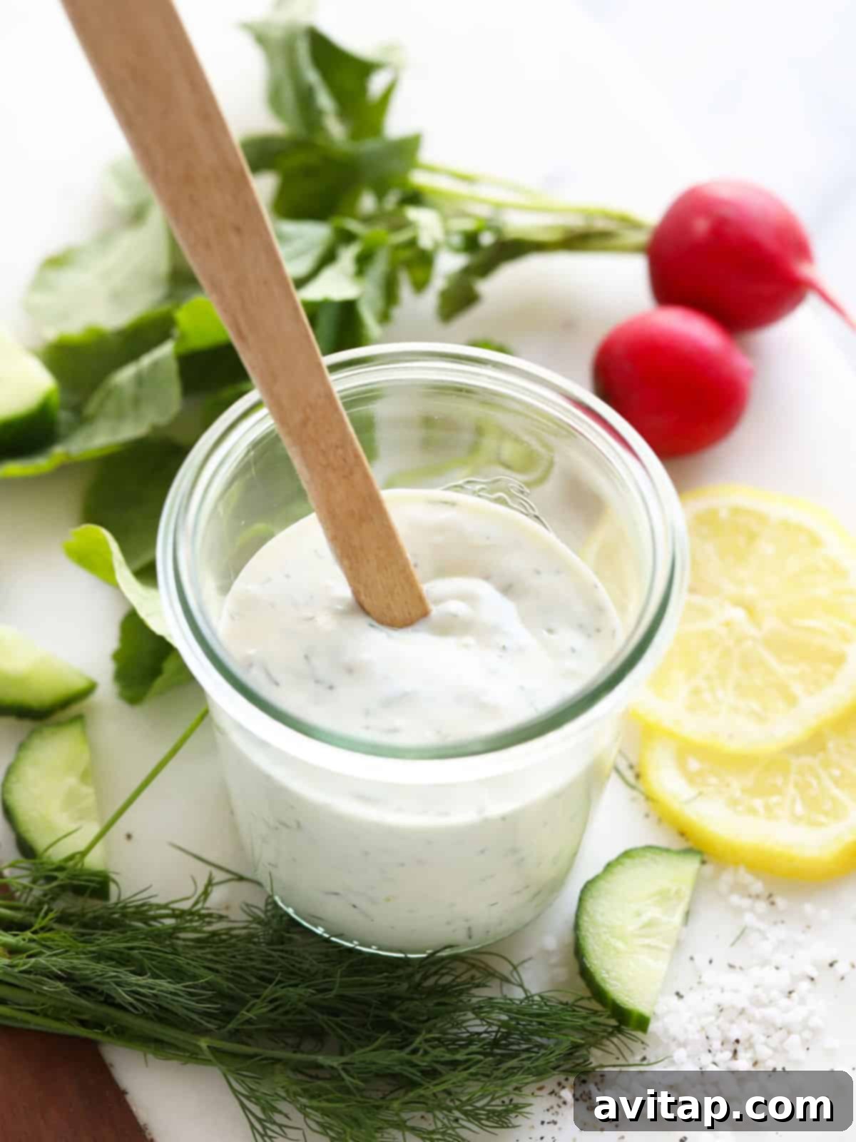 A vibrant, engaging image depicting a healthy Greek yogurt dressing as a web story poster.