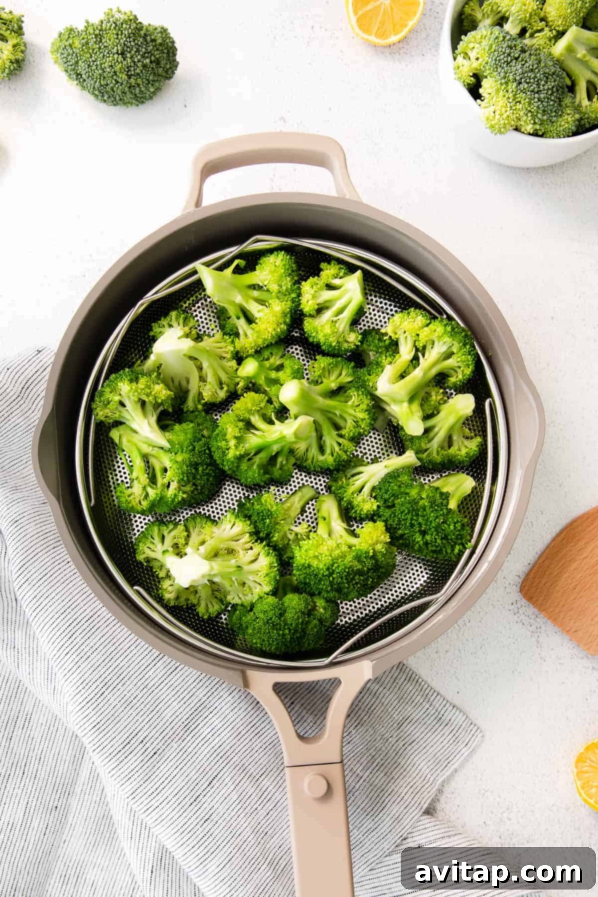 steamed broccoli in steamer basket