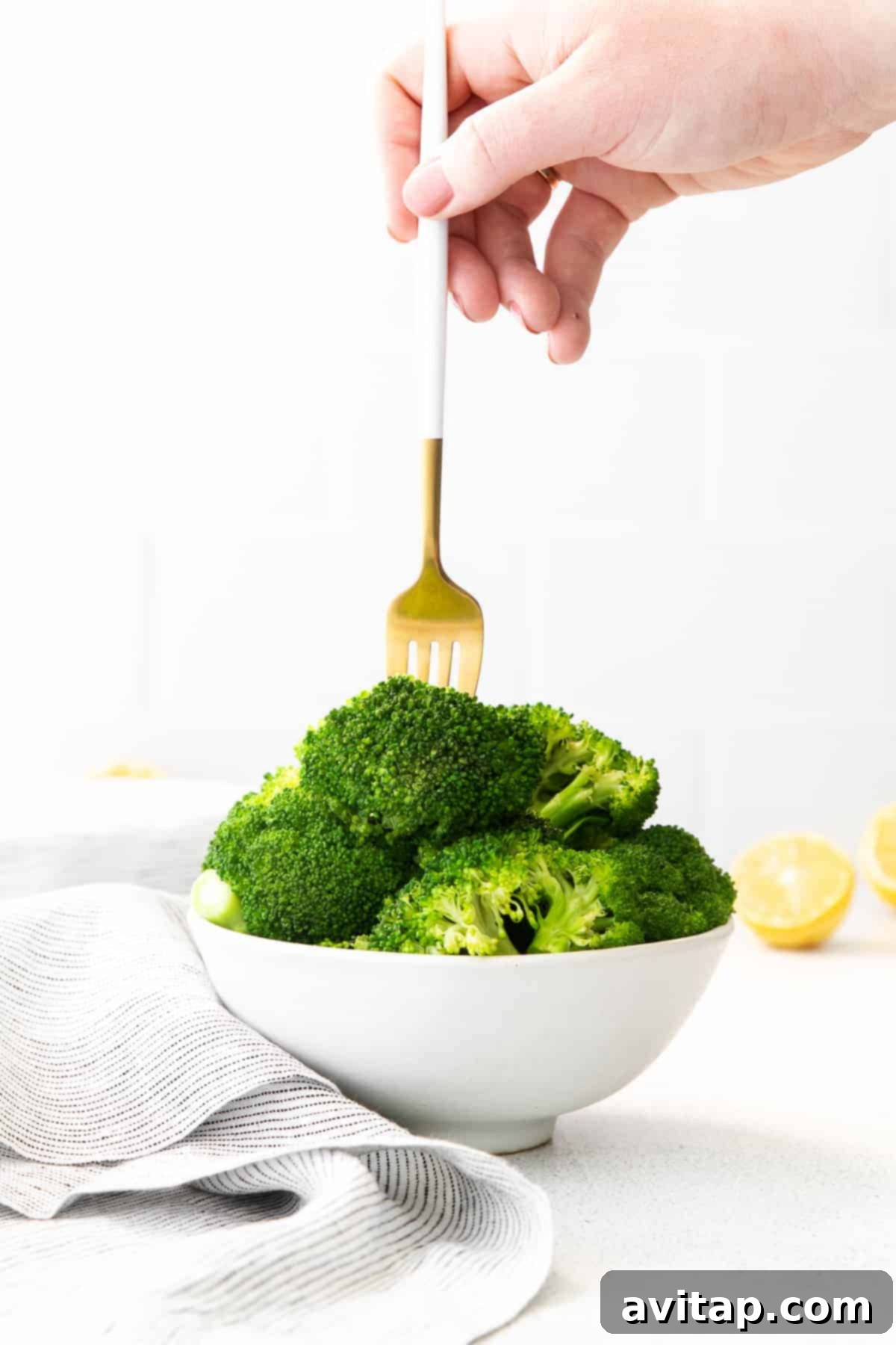 forking a piece of broccoli