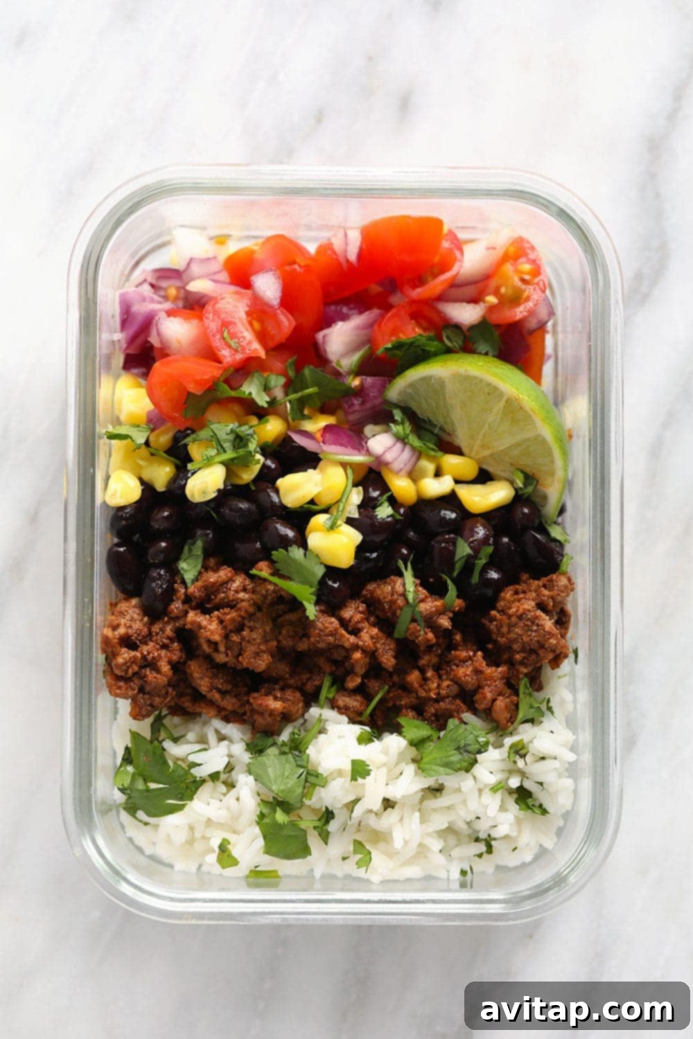 Prepared taco bowls neatly arranged for meal prepping.