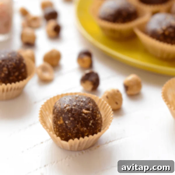 Chocolate hazelnut truffles on a yellow plate.