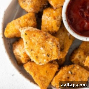 Crispy air fryer chicken nuggets cooked to a golden brown perfection, ready to be enjoyed.