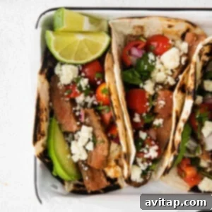 Tasty steak tacos with a twist of feta cheese and tomatoes.