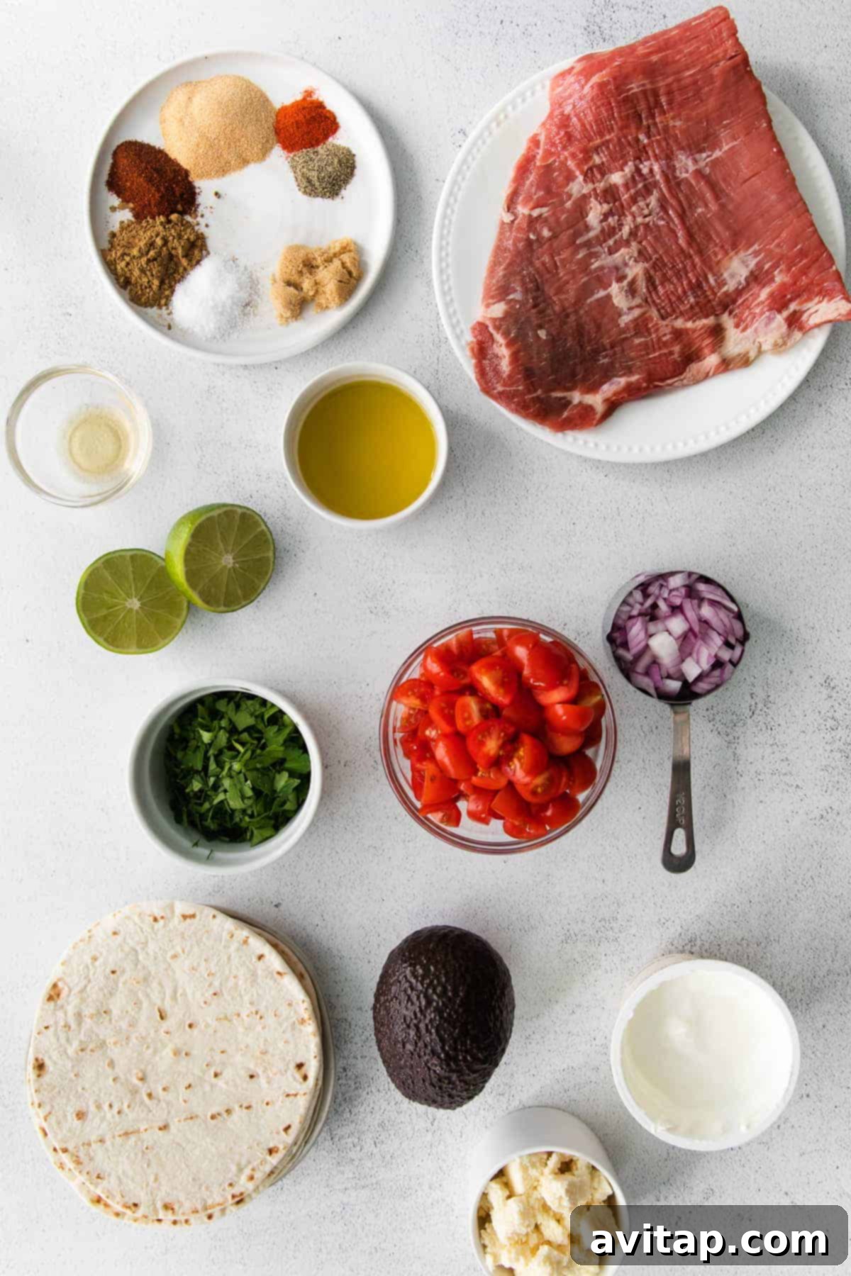 steak taco ingredients in bowls, ready to be mixed together for steak tacos