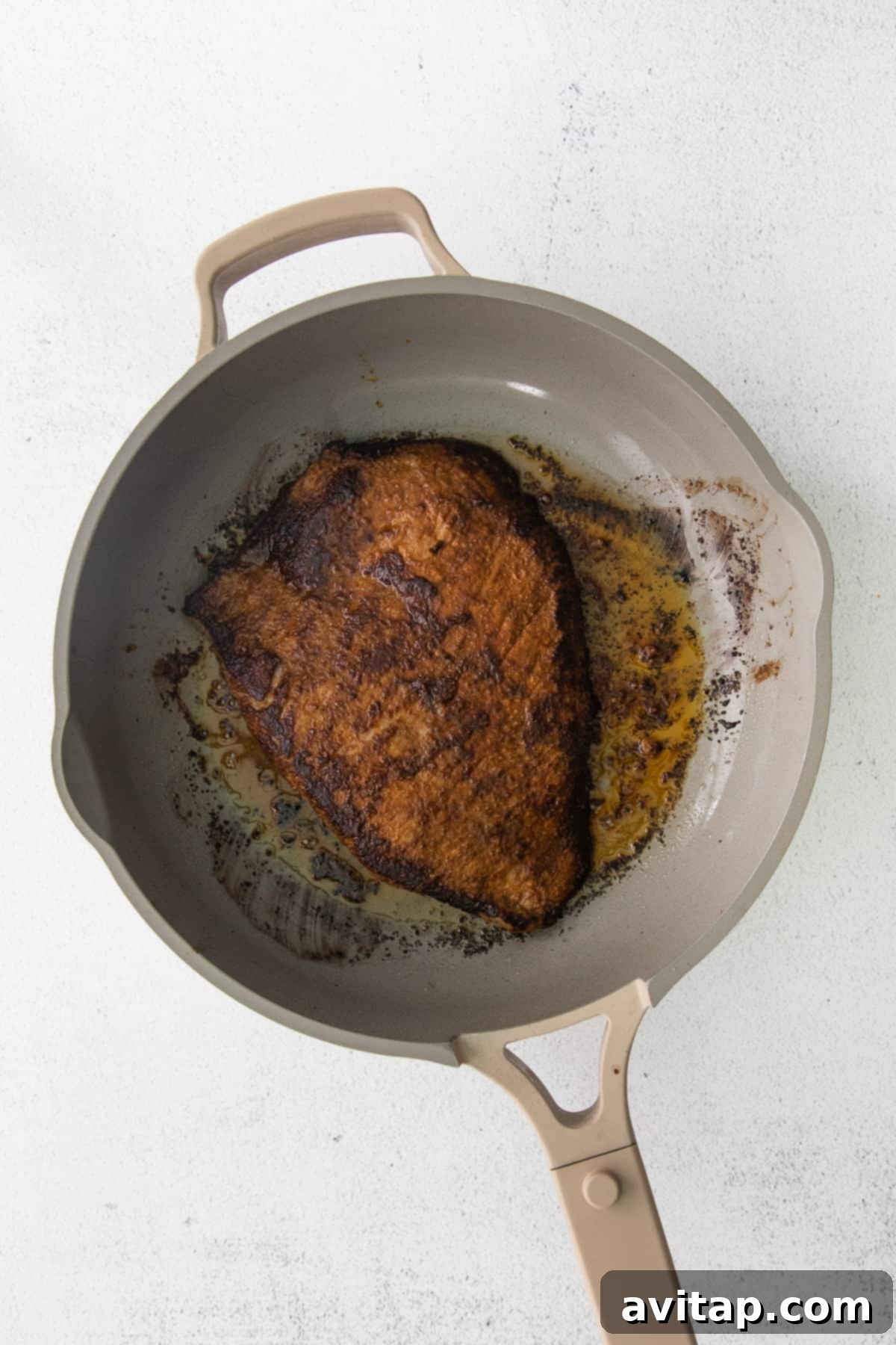 flank steak seared in a pan