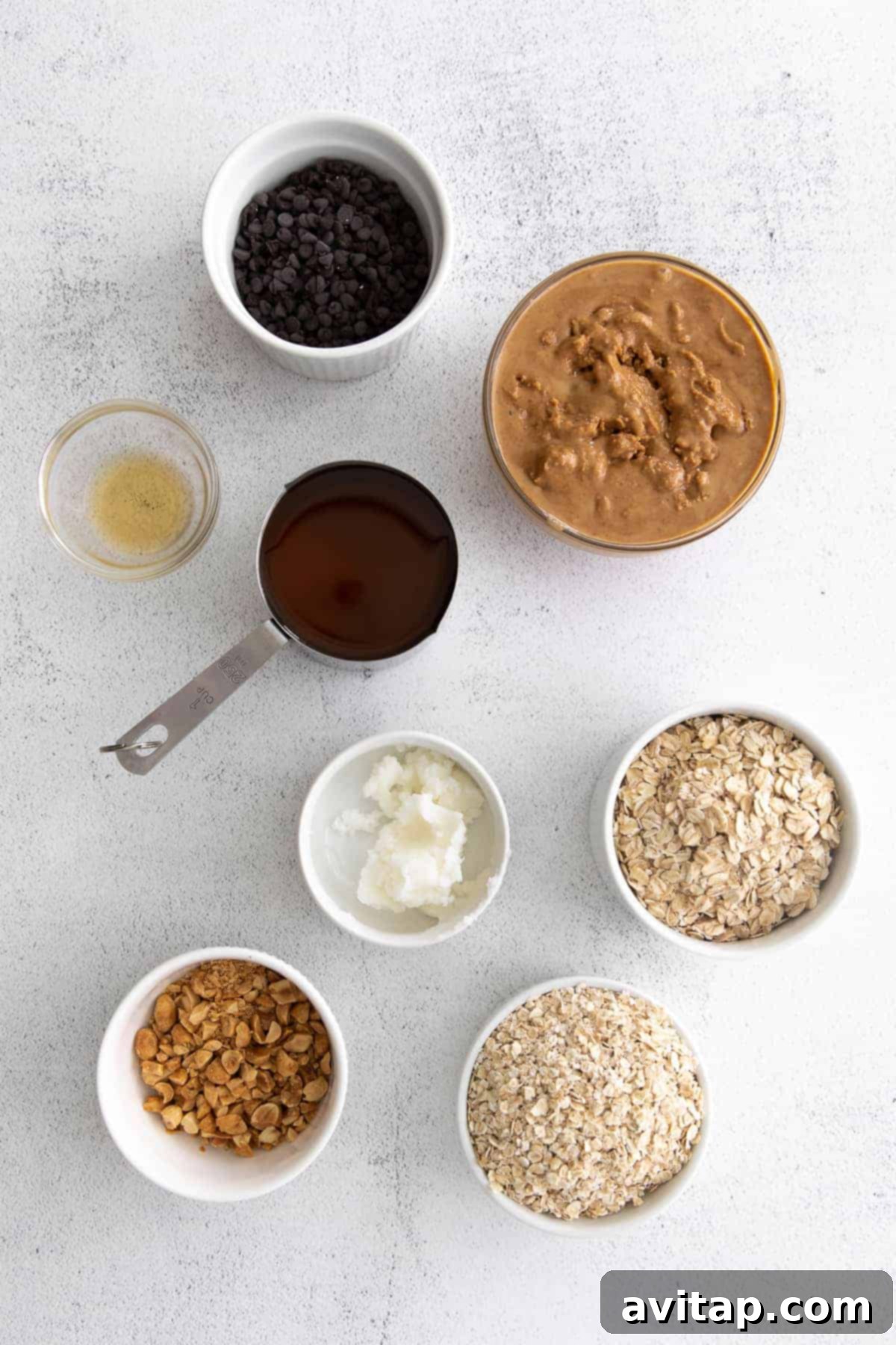 Key ingredients for homemade granola bars laid out on a kitchen countertop